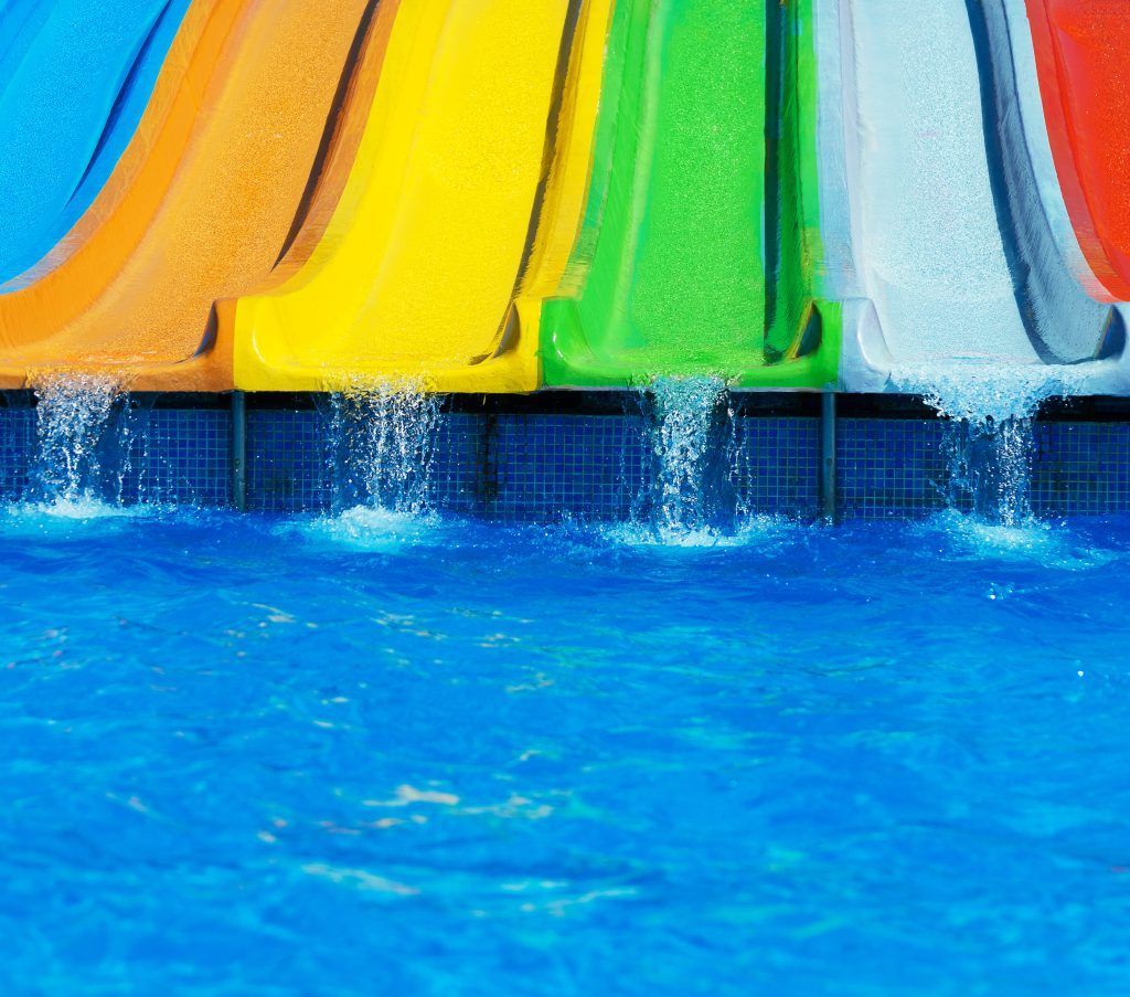 Colorful plastic waterslides in aqua park. Aquatic Ingenieria y